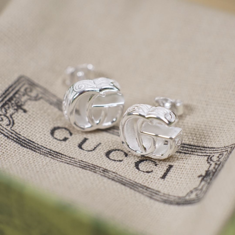 G*u*i earrings